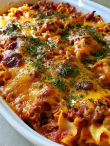 Top-down view of Poor Man's Husband Casserole showing toasted cheese and thick meat sauce. (Poor Man's Husband Casserole)